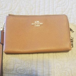 Coach leather double zipper wristlet.